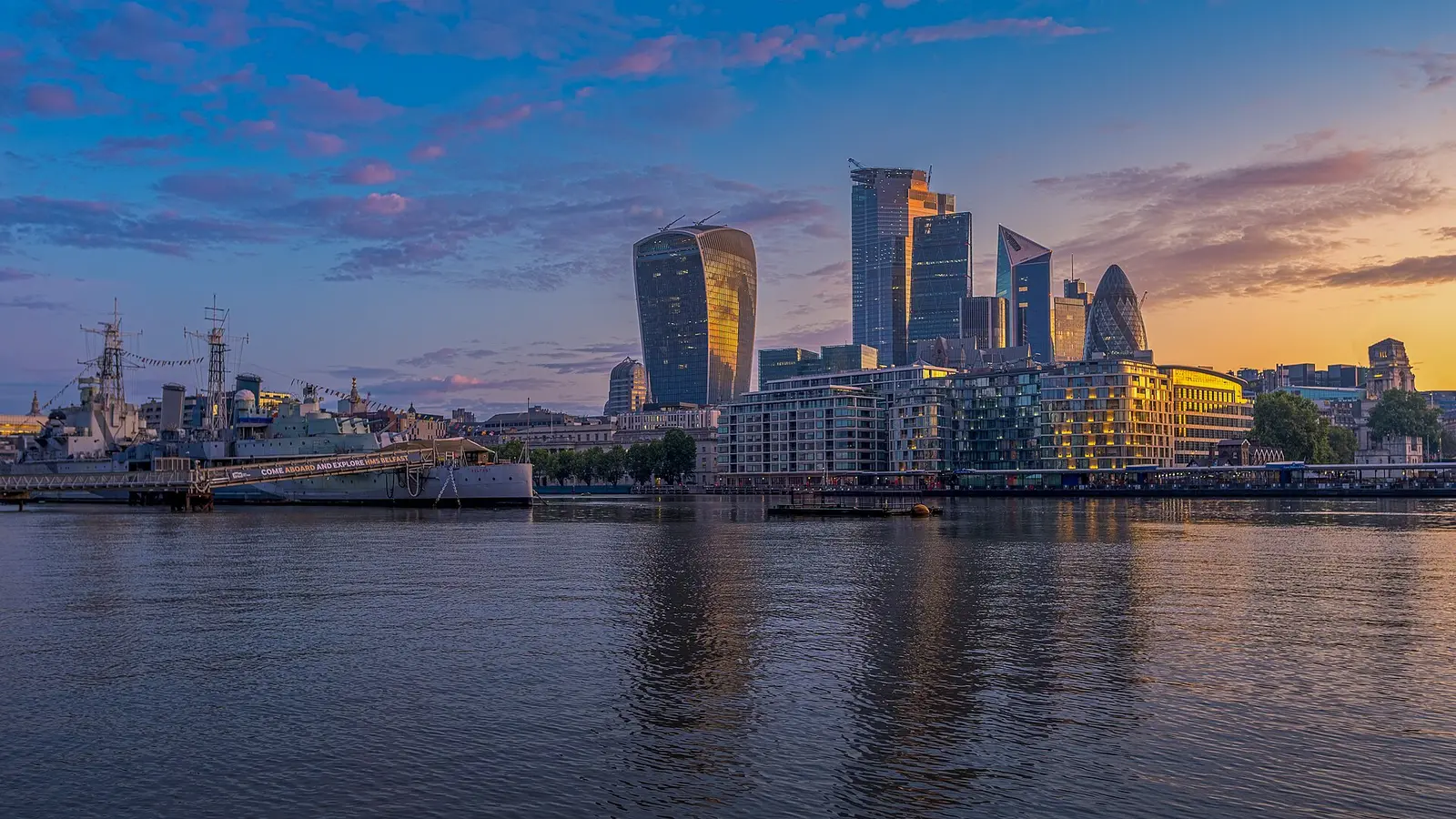 The City of London skyline over the Thames at dusk